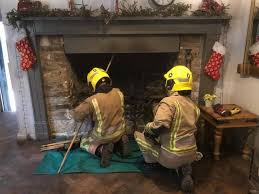 firemen cleaning chimney